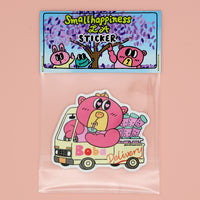 Sticker with a pink bear character driving a truck labeled 'Boba Delivery' in a clear plastic bag on a pink background.