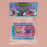 Boss Battle Frog vinyl sticker featuring two cartoon frogs battling on a handheld gaming console screen with the words “Boss Battle: Over” and “Freedom Unlocked” in bold, colorful text, packaged in clear plastic bag branded by SmallHappinessLA