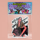 Vinyl sticker in clear plastic package with a branded card head featuring a fierce young woman with braids and jewelry holding a black wolf, with bold text that reads “Wild at Heart, Untamed by Nature,” designed in a dark, moody art style by SmallHappinessLA