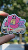 SmallHappinessLA Boba Delivery vinyl sticker featuring a cute pink bear driving a truck full of boba drinks, held in hand in natural daylight