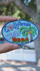 Video of California chill - Palm tree embroidery patch held in hand, showing size, texture, stitching details, and fabric under sunlight.
