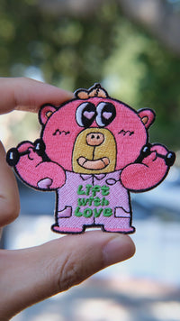 Video of Boba bear workout embroidery patch held in hand, showing size, texture, stitching details, and fabric under sunlight
