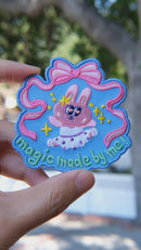 Video of magical ballet embroidery patch held in hand, showing size, texture, stitching details, and fabric under sunlight.

